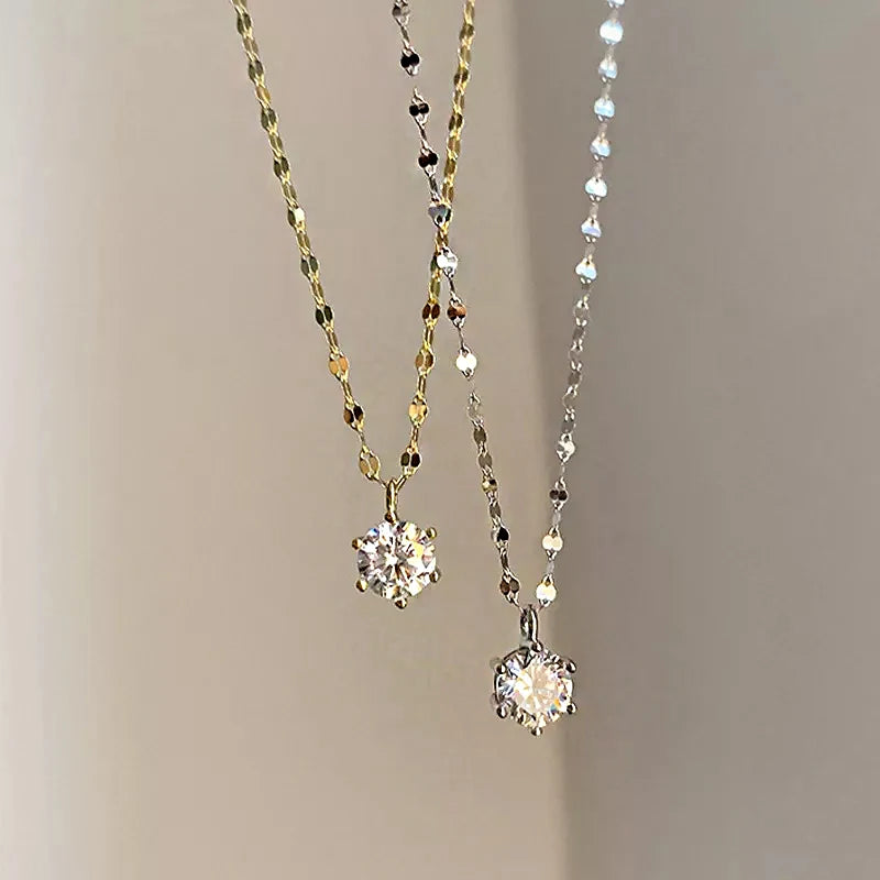 1. gioielli - Collana con ciondolo con zircone